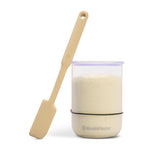 Brod & Taylor Starter Spatula beside a regular starter jar containing sourdough starter.
