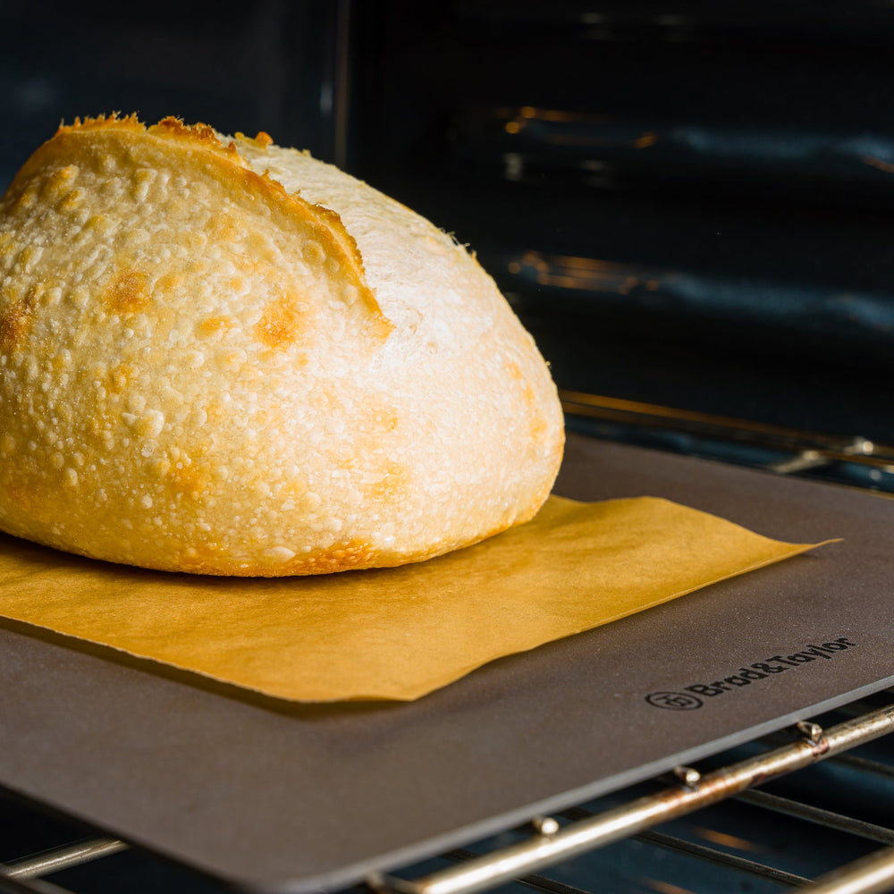 A loaf of sourdough bread on a bread steel.